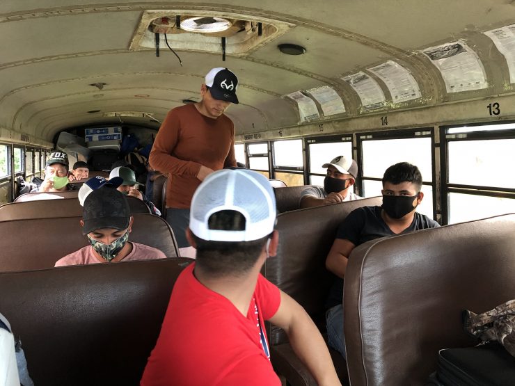 Migrant/seasonal workers from Florida ride a bus to Westover migrant labor camp on the Eastern Shore. The workers typically work 11- to 12-hour shifts there. Photo courtesy of Devon Payne-Sturges