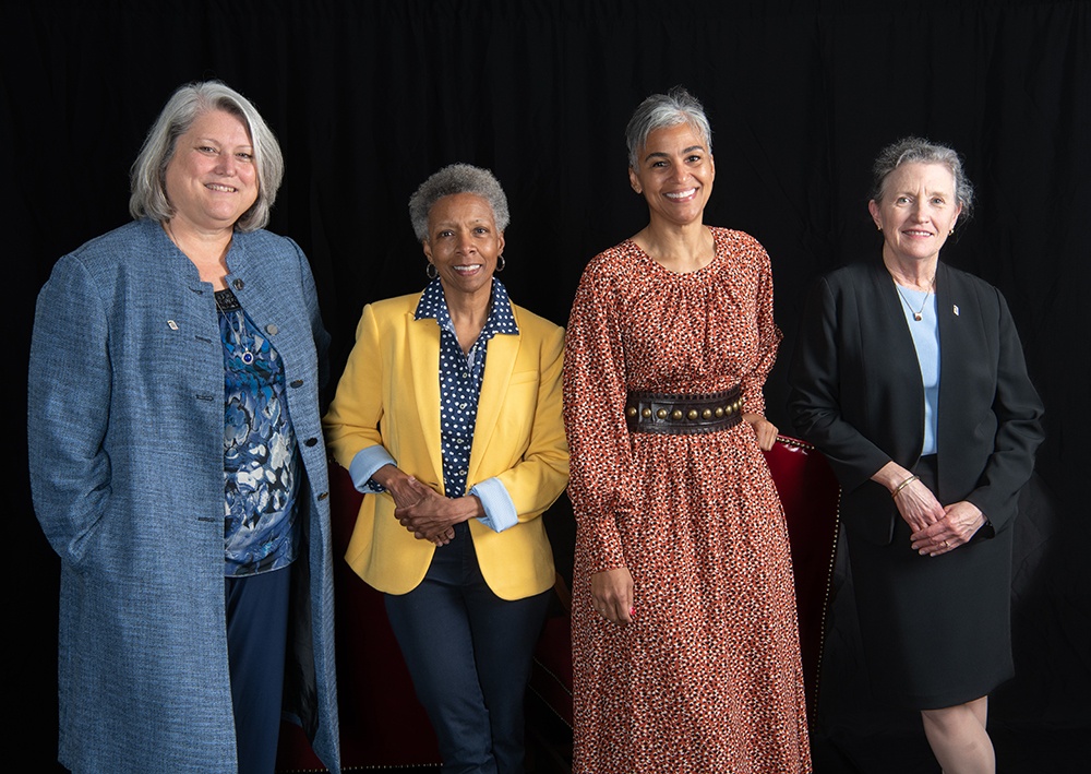 Deans Judy L. Postmus (left to right), Natalie D. Eddington, Renée McDonald Hutchins, and Jane M. Kirschling before a meeting in April. Eddington and Kirschling will step down from their roles at the end of the academic year. Photo by Matthew D’Agostino