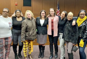 Leigh Goodmark (center), the Clinical Law Program’s co-director, poses with clients in the Maryland Carey Law Moot Courtroom. The law school celebrated the program’s anniversary with the investiture of Goodmark as the Marjorie Cook Professor of Law.