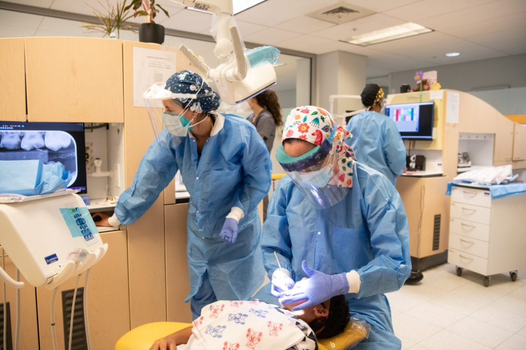 Second-year UMSOD resident Jasmine Butler, DDS, provides treatment to a pediatric dental patient. Photo by Matthew D’Agostino 