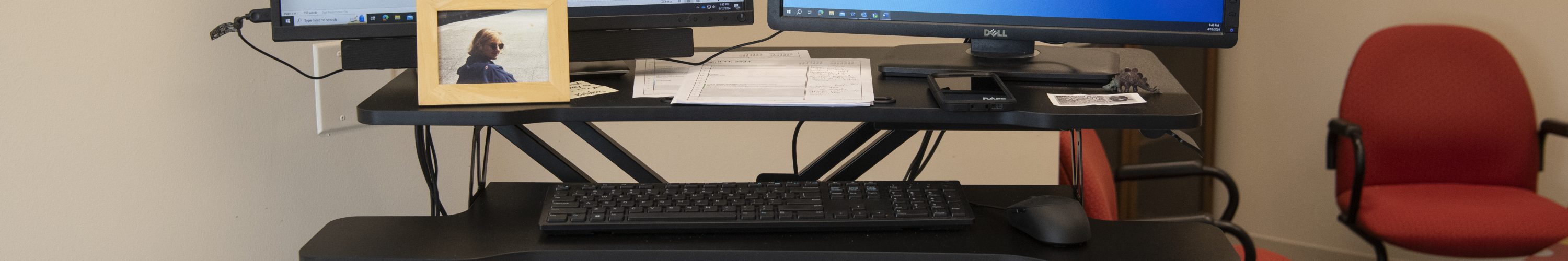 A desk with a computer on it