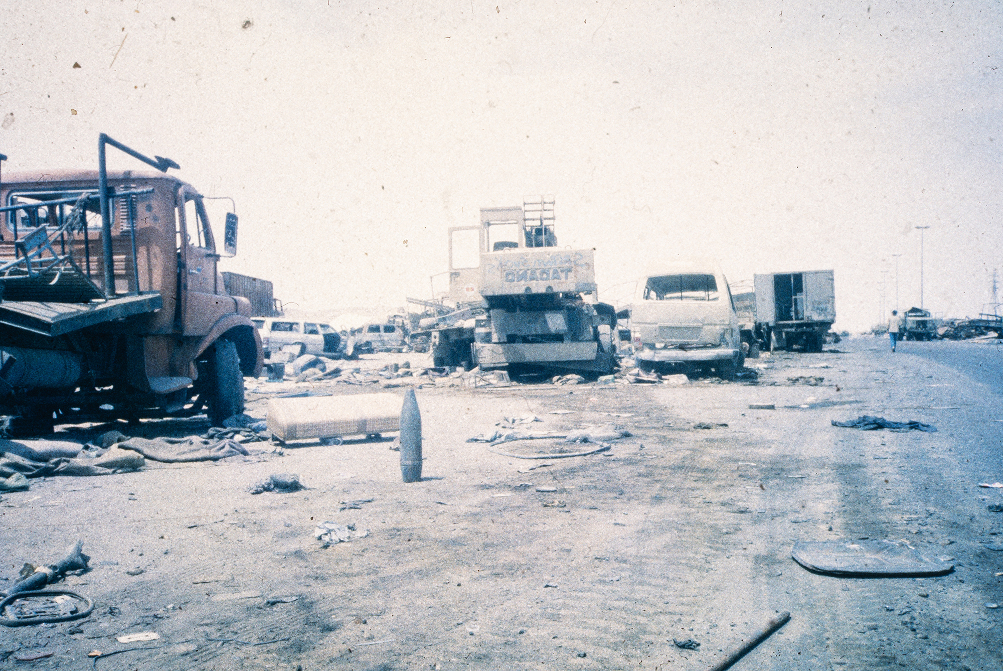 Smashed Iraqi vehicles litter the “Highway of Death” north of Kuwait City.