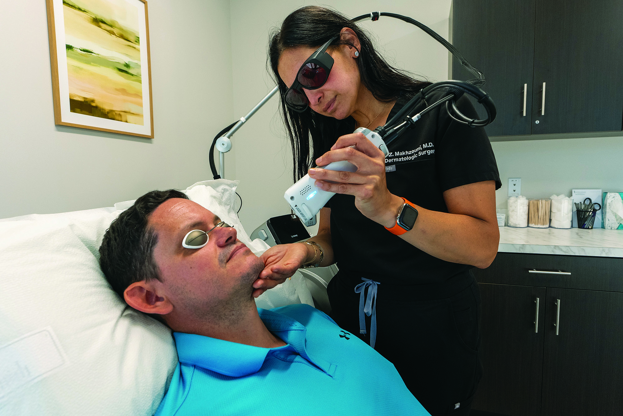 Zaineb H. Makhzoumi, MD, MPH, associate professor and section head, Dermatologic Surgery, Department of Dermatology, treats a patient.