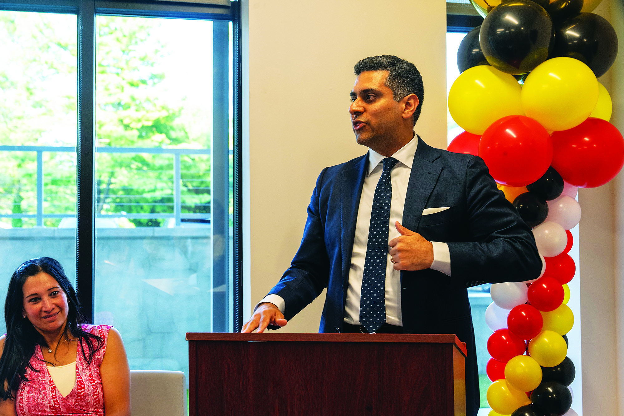 Shawn Kwatra, MD, speaking at a podium