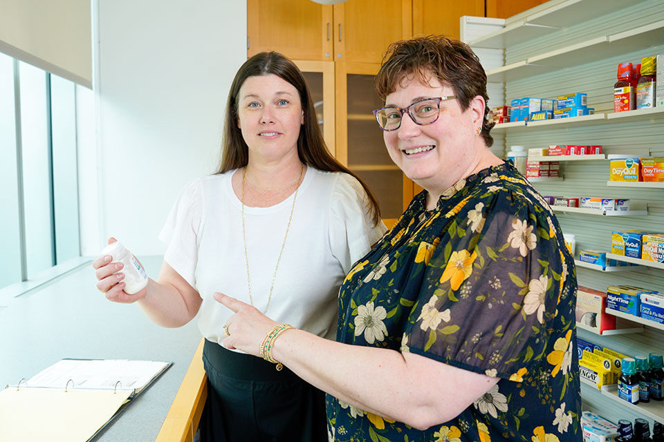 Amy Kruger Howard, PharmD ’17, MS ’21 (left), and Jill Morgan, PharmD, BCPS, BCPPS, FNAP.